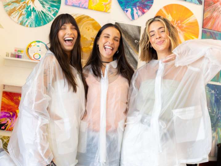 NYC - a group of women smiling and posing in a painting class Shot