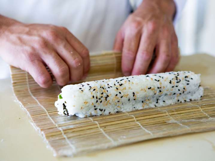 Fort Worth - a woman rolling sushi (2) Shot