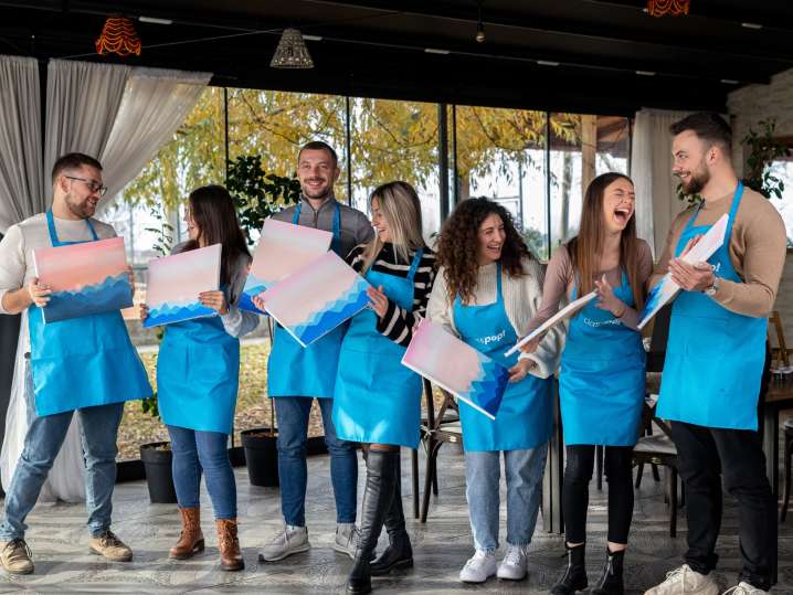 Newport Beach - colleagues laughing in paint and sip event Shot