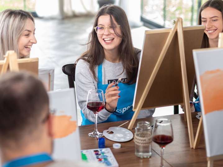 Newport Beach - colleagues laughing in paint and sip event (2) Shot