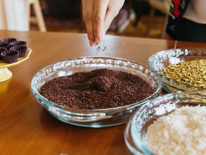 rolling bringadeiros in chocolate sprinkles Shot