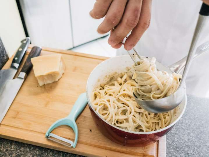 Toronto - preparing alfredo pasta Shot