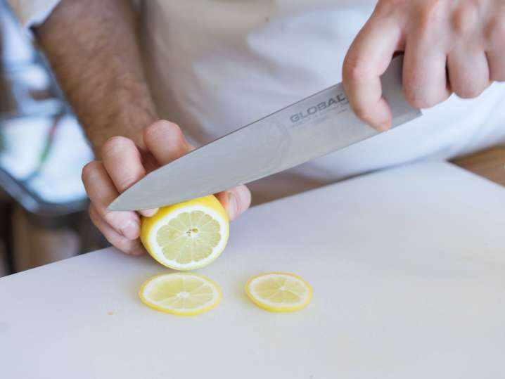Boise - student cutting lemons in sushi making class Shot