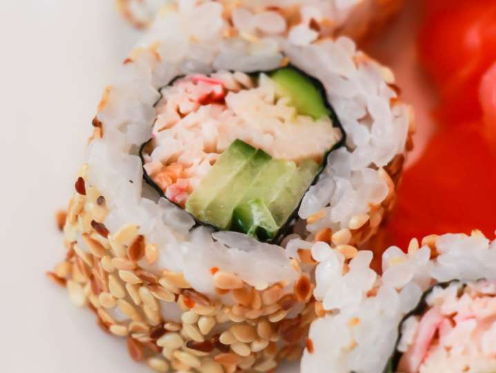 Orlando - Close-up of a sushi roll with crab, cucumber, and sesame seeds Shot