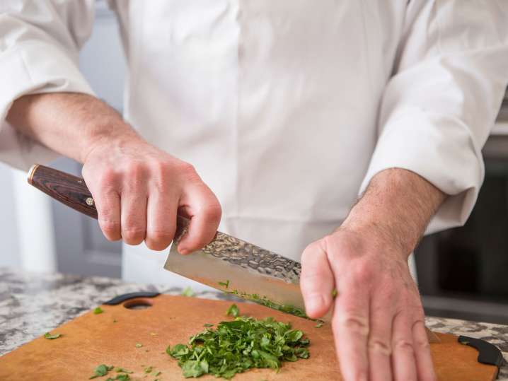 Chicago - chef cutting parsley Shot