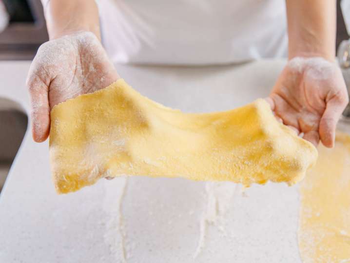 Boston - Chef stretching fresh pasta sheets during a cooking class Shot