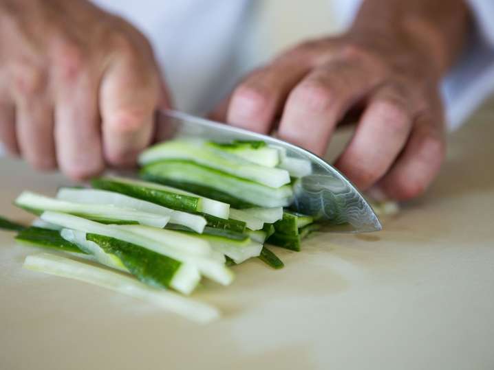 Las Vegas - Chopping fresh cucumber into thin strips for sushi Shot