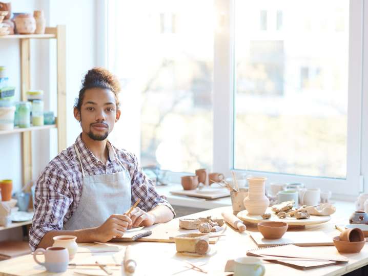 Boston - man creating pottery in handmade pottery class Shot
