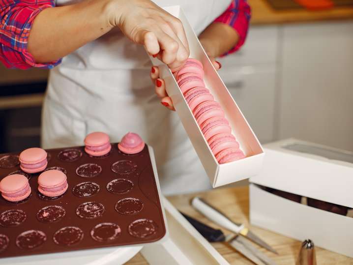 Boston - confectioner-uniform-decorates-macaroni Shot