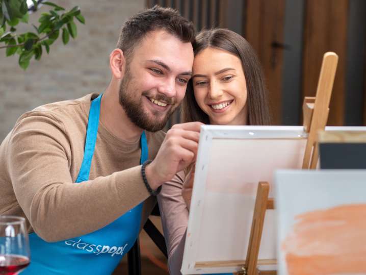 Portland - Couple painting together during a romantic paint and sip class Shot