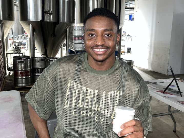a man holding his handmade candle Shot