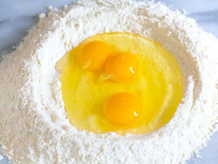 NYC - fresh flour with eggs for pasta dough Shot