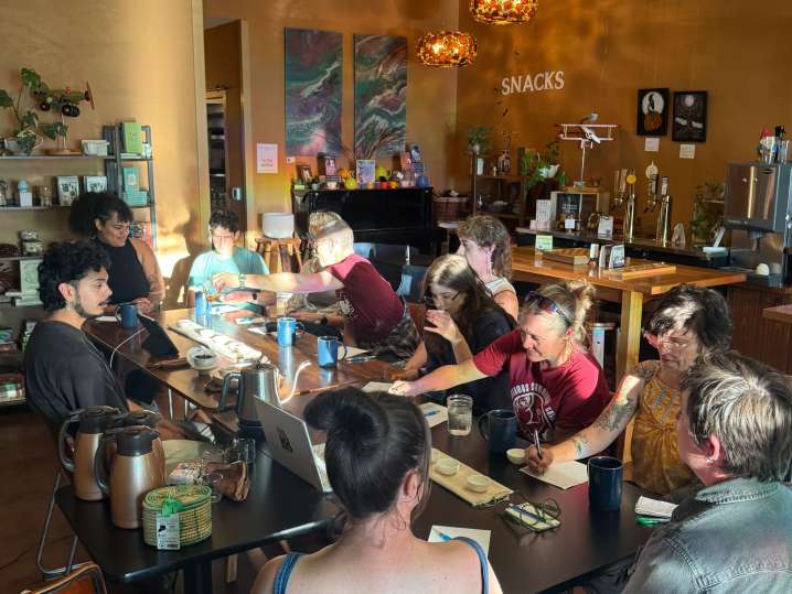 Portland - Large group tasting and discussing teas together in a cozy tea classroom Shot
