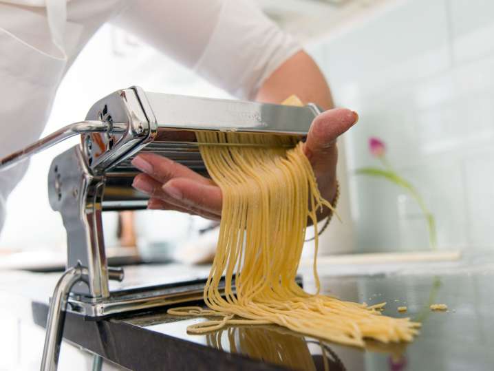 Philadelphia - making spaghetti through pasta machine Shot
