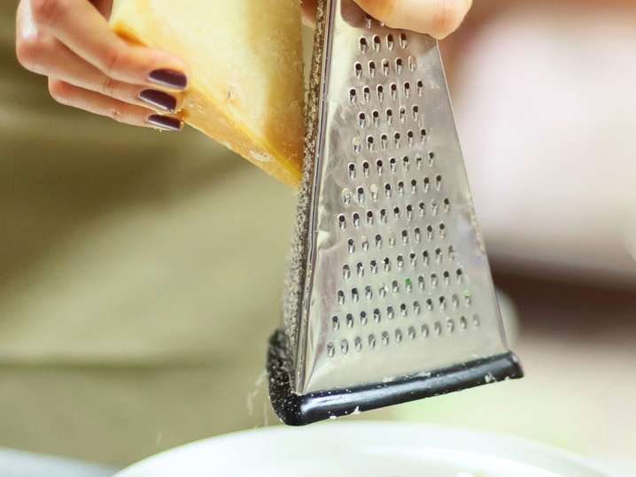 San Antonio - grating fresh Parmesan cheese Shot