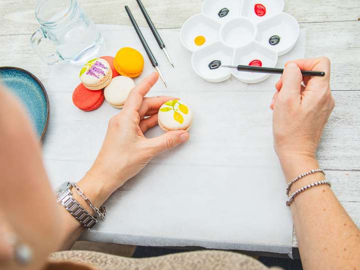 Atlanta - a woman painting macarons by hand (2) Shot