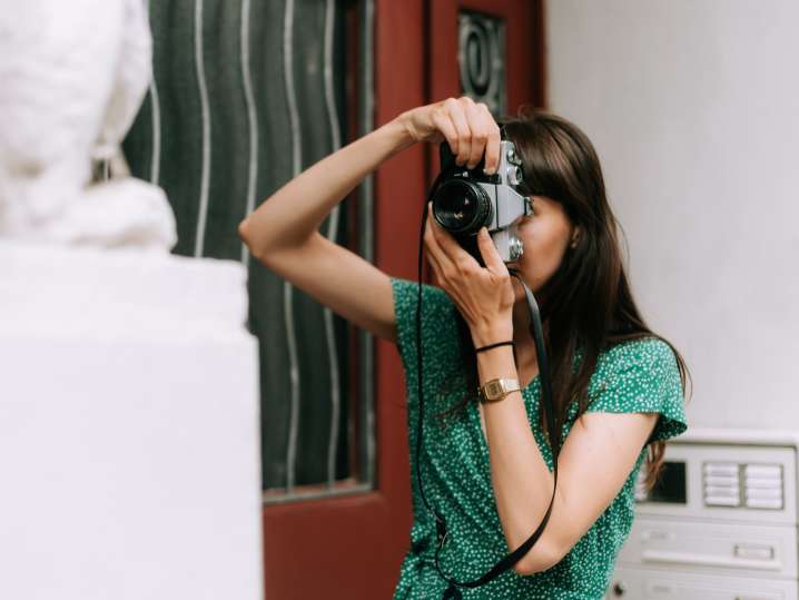 NYC - a woman taking photography Shot