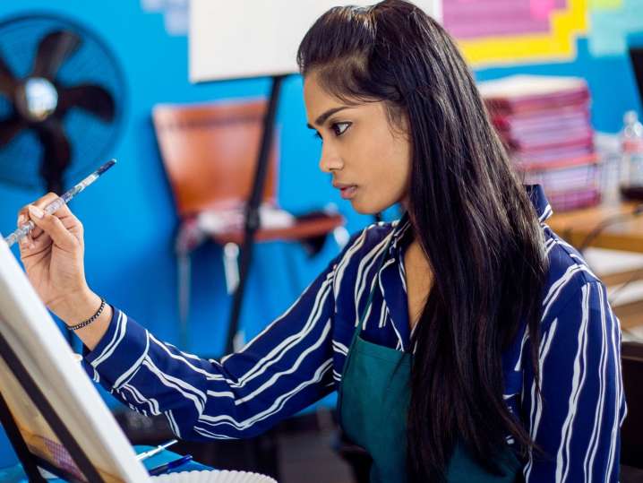 Nashville - a woman painting a canva Shot
