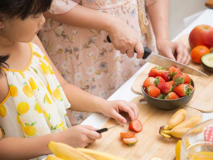 Charlotte - kid cutting strawberries Shot