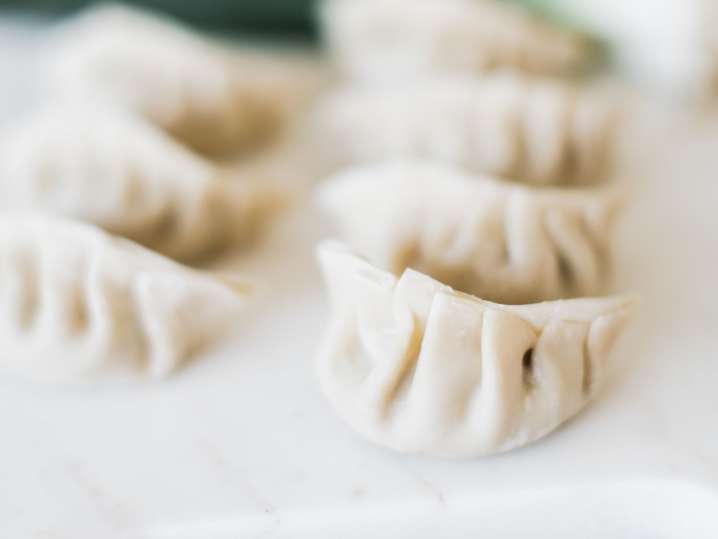 Cleveland - Close-up of raw dumplings resting on a floured surface before cooking Shot