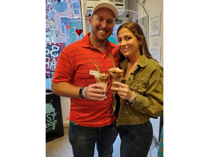 NYC - couple holding their handmade sundae Shot