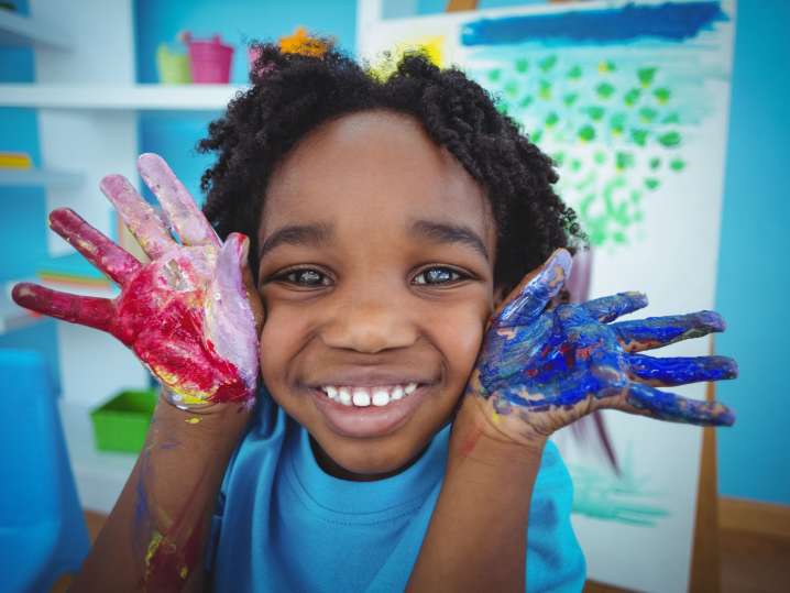 Charlotte - kids laughing with paint on the hands Shot