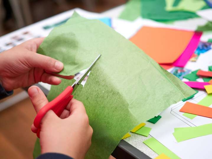 Charlotte - a kid cutting scissors Shot