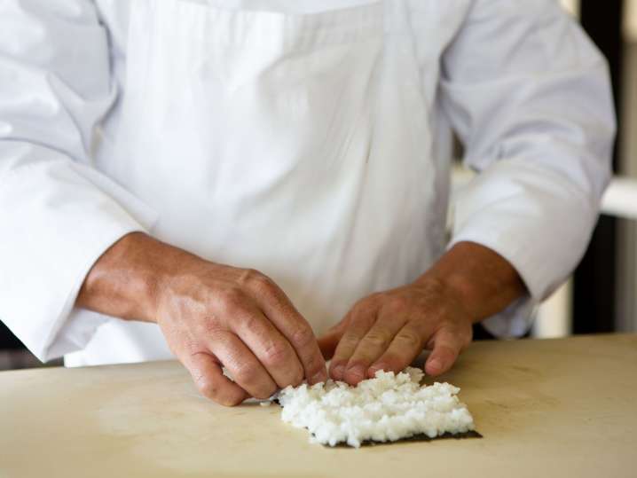Las Vegas - chef laying out sushi rice Shot