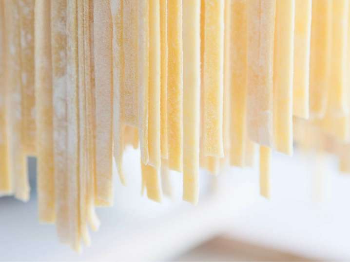Toronto - Close-up of fettuccine pasta hanging to dry Shot