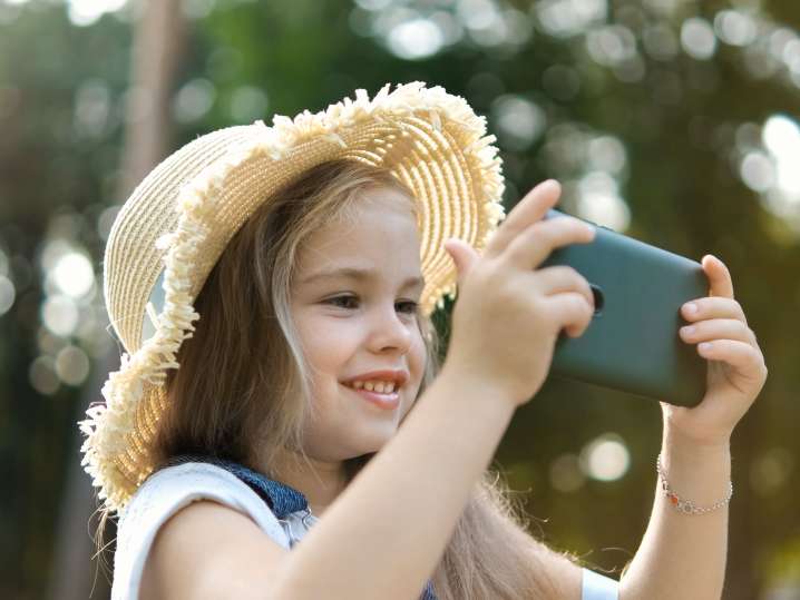 NYC - a little girl taking picture with a phone Shot