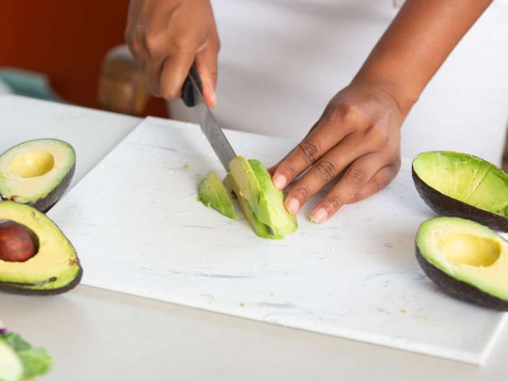 Houston - 3 chef slicing avocados for homemade guacamole copy Shot