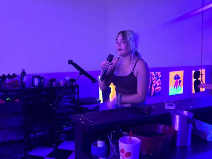 Houston - a woman singing karaoke Shot