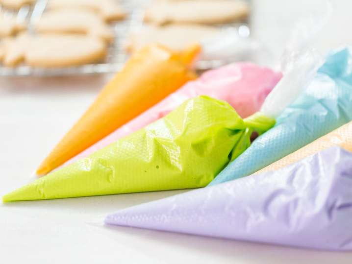 Boston - Colorful piping bags filled with icing for decorating sugar cookies Shot