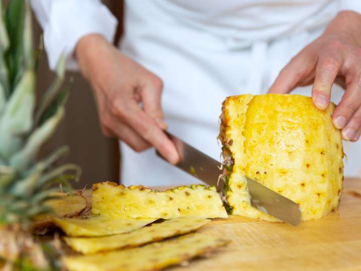 chef slicing a pineapple | Classpop Shot