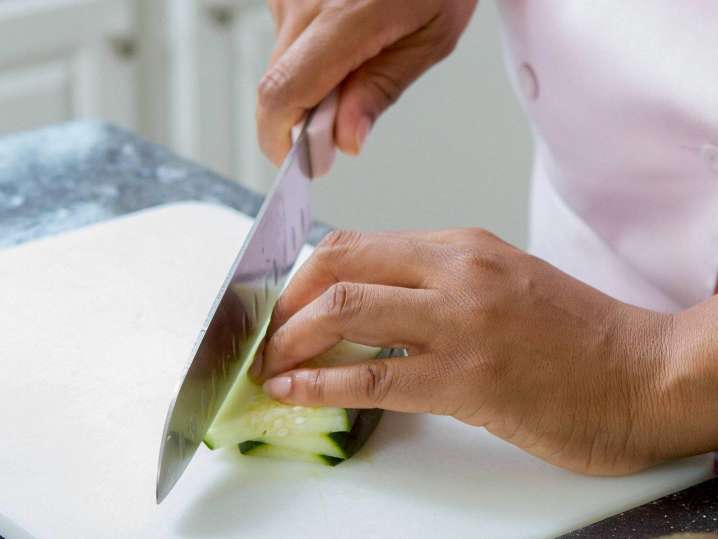 chef slicing a fresh cucumber | Classpop Shot