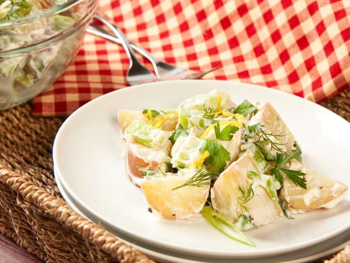 Creamy potato salad with herbs and lemon zest ready for picnic | Classpop Shot