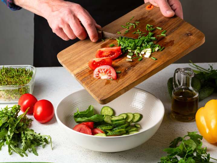 Preparing a vibrant veggie salad | Classpop Shot
