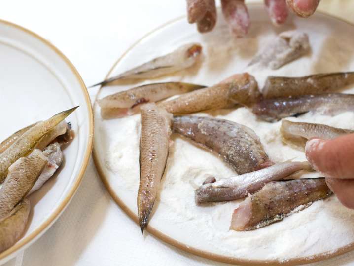 Coating sardines for frying | Classpop Shot