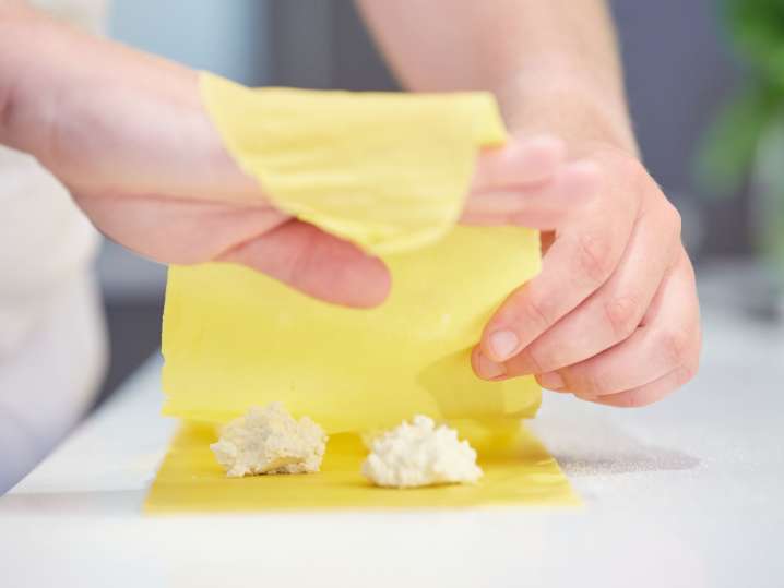 folding pasta cheet for ricotta stuffed ravioli making | Classpop Shot