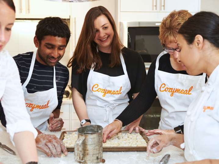team making gnocchi pasta in Cozymeal aprons | Classpop Shot