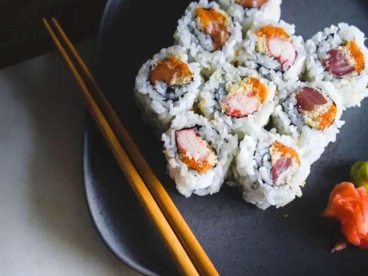 delicious sushi elegantly served on a black dark plate | Classpop Shot