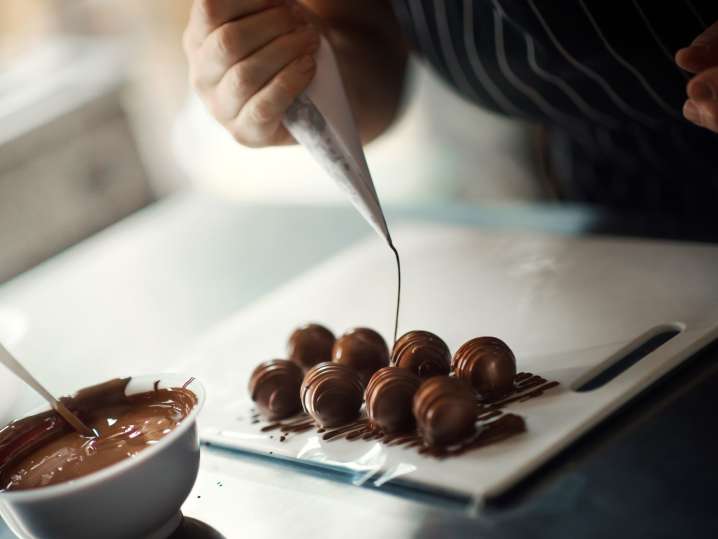 piping chocolate over truffles | Classpop Shot