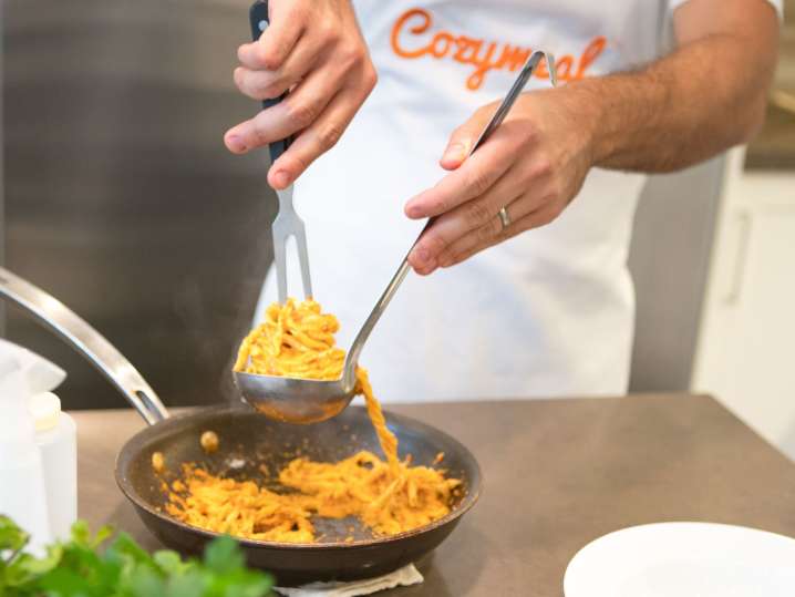 coating tagliatelle pasta in marinara sauce | Classpop Shot