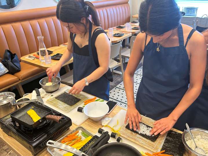 cooking class participants making sushi by hand | Classpop Shot