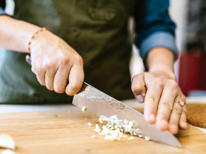 cutting garlic on a wooden board | Classpop Shot