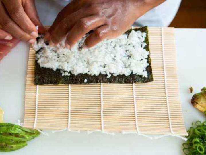 laying sushi rice on nori Shot