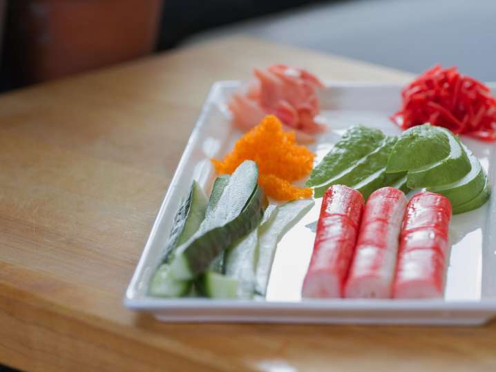 Imitation crab, cucumber, and avocado in a tray Shot