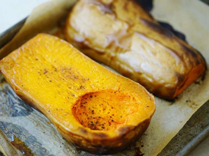 roasted butternut squash on a baking tray Shot