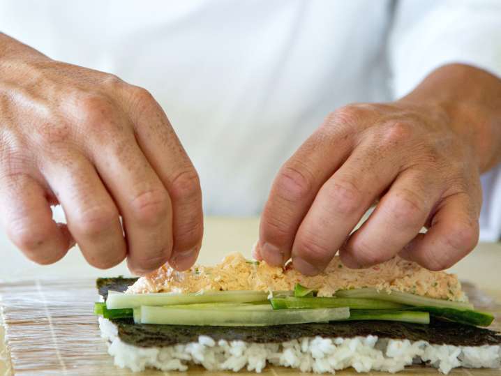 rolling spicy california sushi rolls Shot