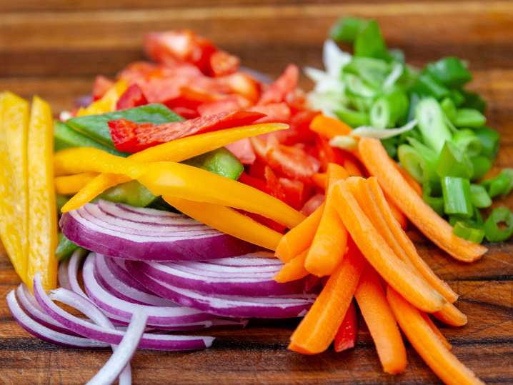 thinly sliced vegetables on a cutting board Shot